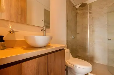 a bathroom with a bowl sink and a toilet at Luxury Exlusive Panoramic View & Historic Center in Cartagena de Indias