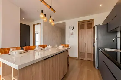 a kitchen with a white counter top and a refrigerator at Luxury Exlusive Panoramic View & Historic Center in Cartagena de Indias