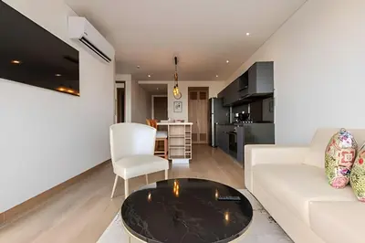 a living room with a white couch and a table at Luxury Exlusive Panoramic View & Historic Center in Cartagena de Indias