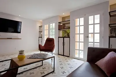 a living room with a couch and a table at Apartamento Bovedas, Aldaba Selection in Cartagena de Indias