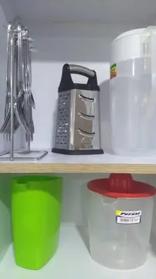a shelf with a kitchen utensils and a blender at Apto 202, área mtana de Barranquilla in Soledad
