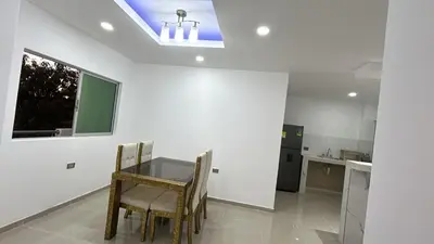 a kitchen with a table and chairs in a room at Casa Cristal Apto x Dia! in Aracataca