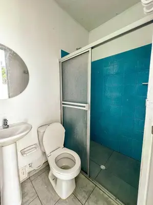 a bathroom with a toilet and a sink and a shower at Casa de Playa ROSANI in Coveñas