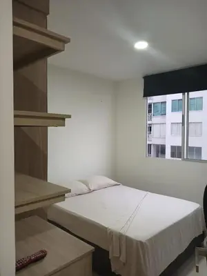 a bed in a room with a window at Jardin imperial, habitaciones economica en apartamento familiar zona tranquila WIFI in Cartagena de Indias