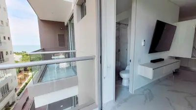 a bathroom with a toilet and a window at PLAYA BELLO HORIZONTE 