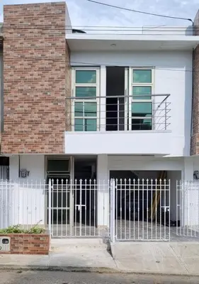 a white fence in front of a house at MONTEMAR Casa 2 in Santiago