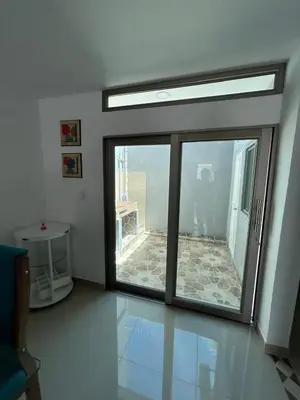 a sliding glass door with a view of a patio at MONTEMAR Casa 2 in Santiago