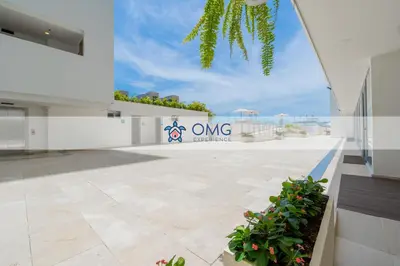 a large white building with a sign that reads one ownership at CB1330 | Hermosa Suite Vista 180° 7min del Centro in Cartagena de Indias