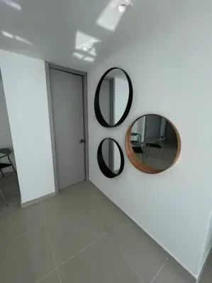 a white room with two mirrors on the wall at Apartment with direct access to the Sea in CTG in Cartagena de Indias