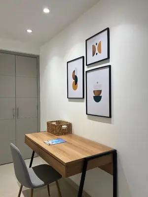 a dining room table with a chair and pictures on the wall at Apartment with direct access to the Sea in CTG in Cartagena de Indias