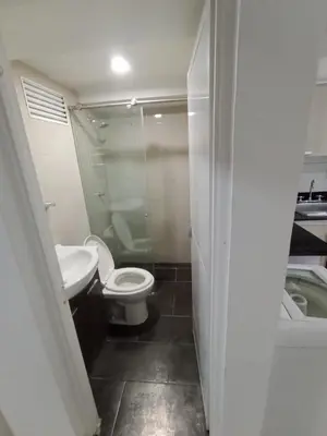 a small bathroom with a toilet and a sink at Apto Marbella in Cartagena de Indias