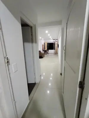 an empty hallway with white walls and white floors at Apto Marbella in Cartagena de Indias