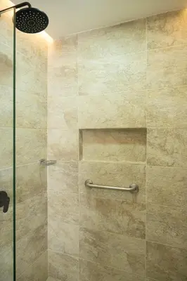 a bathroom with a shower with a glass door at Luxury Oceanfront Apartment in Cartagena Centro in Cartagena de Indias