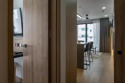 a door to a room with a kitchen and a table at Luxury Oceanfront Apartment in Cartagena Centro in Cartagena de Indias