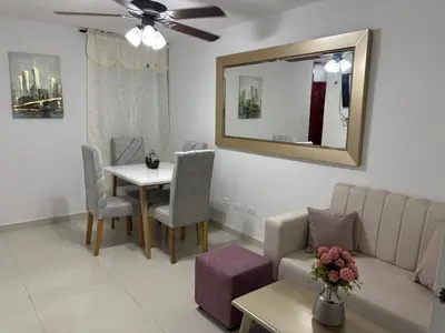 a living room with a couch and a table at Sol Serena in Soledad