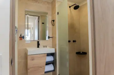 a bathroom with a sink and a shower at CB906 | Encantadora suite ocean view y diseño cálido in Cartagena de Indias