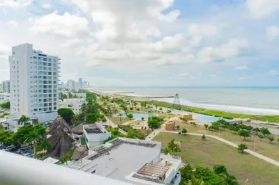 a view of the beach from the balcony of a building at CB906 | Encantadora suite ocean view y diseño cálido in Cartagena de Indias