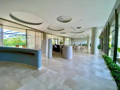a lobby of a building with tables and chairs at Morros EOS Manzanillo piso 3 in Cartagena de Indias