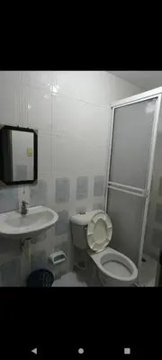 a bathroom with a toilet and a sink at Hotel la Bastilla in Sincelejo