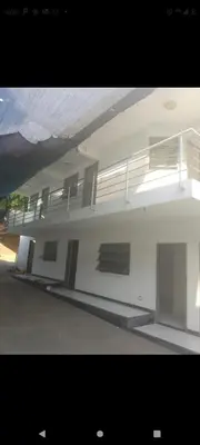 a white building with balconies on the side of it at Hotel la Bastilla in Sincelejo
