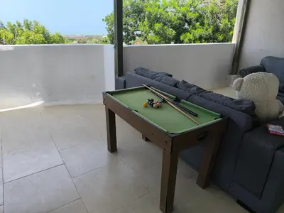a living room with a pool table and a couch at CasaNegreteHostalBoutique in Cartagena de Indias