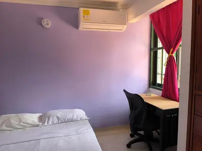 a bedroom with a bed and a desk and a window at CasaNegreteHostalBoutique in Cartagena de Indias