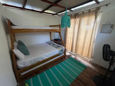 a bedroom with two bunk beds and a window at Shekina Club House in Playa Blanca