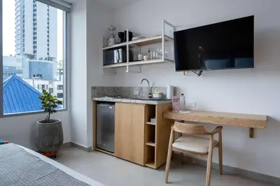 a kitchen with a sink and a desk in a room at San Martin by Wynwood House in Cartagena de Indias