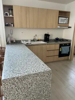 a kitchen with a counter top and a stove top oven at Apartamento Torre Vela- Coveñas in Coveñas
