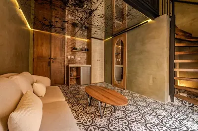 a living room with a couch and a table at Hotel Villa Alta Guest House in Cartagena de Indias