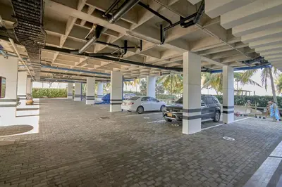 a large parking lot with cars parked in it at Magico Apartamento Frente al Mar 3 Habitaciones PAZ282 in Coveñas