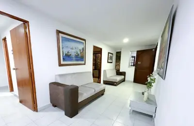 a living room with a couch and a chair at Hotel CasaBlanca ctg in Cartagena de Indias