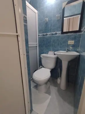 a bathroom with a toilet and a sink at La fantástica Mi Hostal in Cartagena de Indias