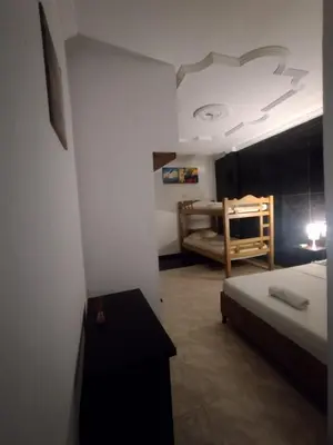 a bedroom with a bed and a bunk bed at La fantástica Mi Hostal in Cartagena de Indias
