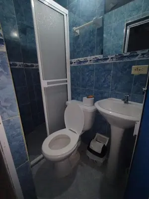 a bathroom with a toilet and a sink at La fantástica Mi Hostal in Cartagena de Indias