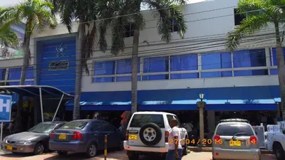 a group of cars parked in front of a building at Mintaka Hotel + Lounge in Cartagena de Indias