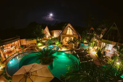 an aerial view of a pool at night at VelaNova Paradise - HotelRetreat in Isla Fuerte