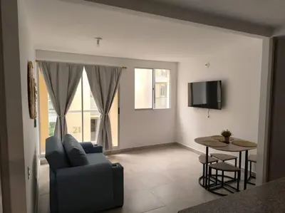 a living room with a couch and a table at Acogedor espacio -Serena del Mar in Cartagena de Indias