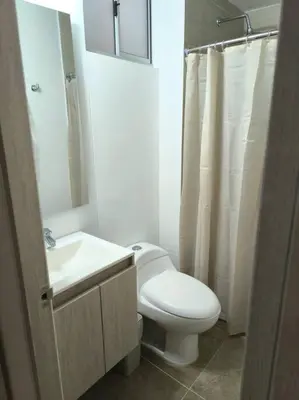 a bathroom with a white toilet and a sink at Acogedor espacio -Serena del Mar in Cartagena de Indias