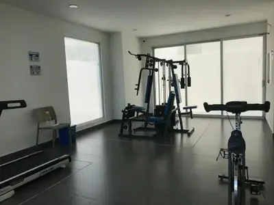 a gym with two treadying machines in a room at Apartamento Bello Horizonte Santamarta in Santa Marta