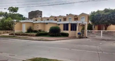 a row of houses on the side of a street at Habitación Canarios in Barranquilla