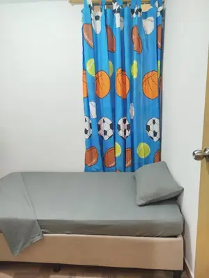 a bed in a room with a curtain at La casita de jo in Cartagena de Indias