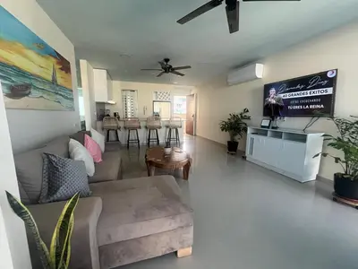 a living room with a couch and a table at Lux Oceanfront Apartment in Cartagena de Indias