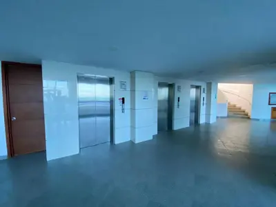 an empty hallway with elevators and doors in a building at Apto Luxury cartagena 2401 Palmetto1 Frente al Mar in Cartagena de Indias