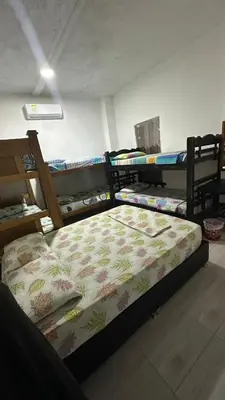 a bedroom with two bunk beds in a room at Hostal la muralla getsemani in Cartagena de Indias