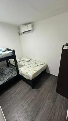 a small room with two bunk beds in it at Hostal la muralla getsemani in Cartagena de Indias