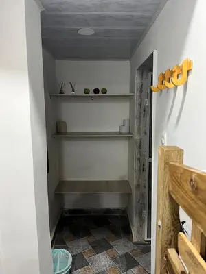 a stairway with shelves in a room with a floor at Hostal la muralla getsemani in Cartagena de Indias
