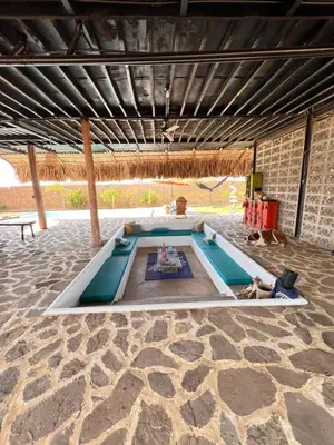 a swimming pool in the middle of a patio at Surf Mojarra Beach Habitación privada con vista al mar in Salina de Rey