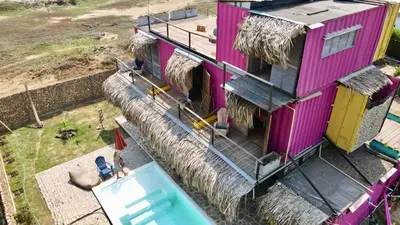 an overhead view of a house with a swimming pool at Surf Mojarra Beach Habitación privada con vista al mar in Salina de Rey