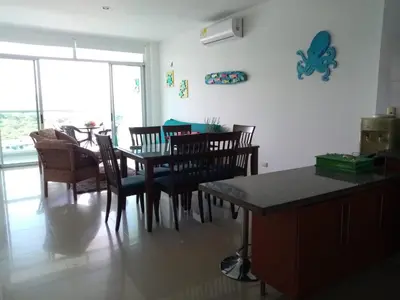 a dining room with a table and chairs at Apartamento Frente al Mar in Santa Marta